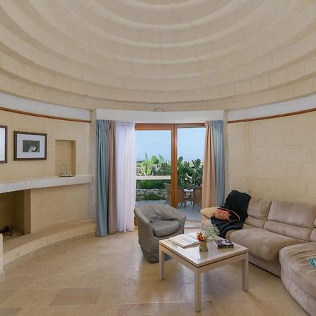 Hotel Ta' Cenc & Spa Sannat Exterior photo A living room in a suite at the Atlantis Paradise Island